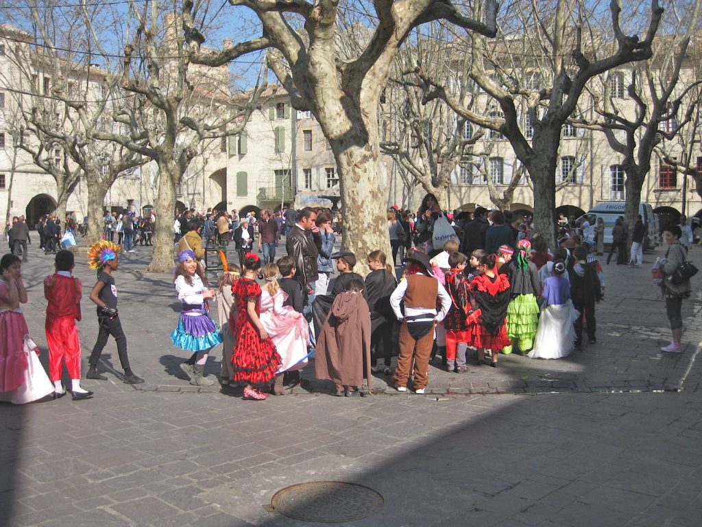 Children in a carnival in Place aux Herbes Uzes