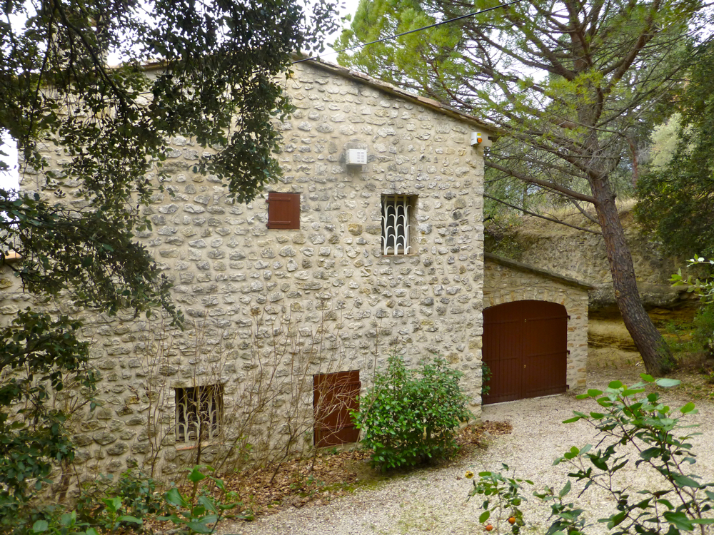 Provencal Mas, shallow pitched roof and small shuttered windows