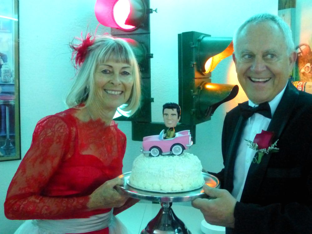Bride & Groom with their cake