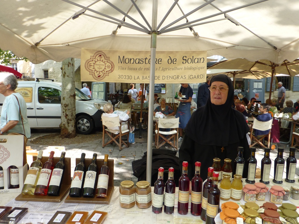 Nuns selling wine in the Uzes market, Languedoc Roussillon, France