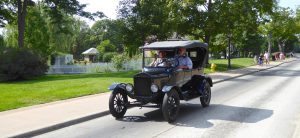 Model T Ford driving round Greenfield Village