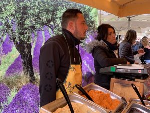 Vendors in the Lourmarin market, Lourmarin, Luberon, Provence, France