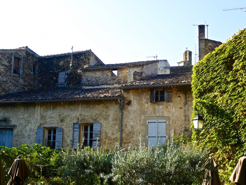 Shutters of Provence on an old building in Lourmarin, Luberon, Provence, France