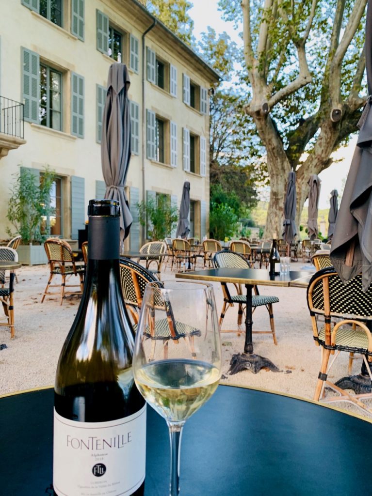 Wine on the terrace at Domaine de Fontinelle, Lauris, Luberon, Vaucluse, Provence, France