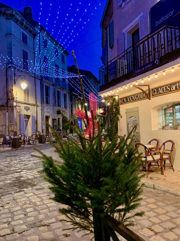 Baby Christmas trees fringing the streets of Lourmarin, Luberon, Provence, France