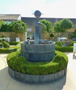 Topiary courtyard at Daylesford Barns, Gloucestershire, The Cotswolds, UK