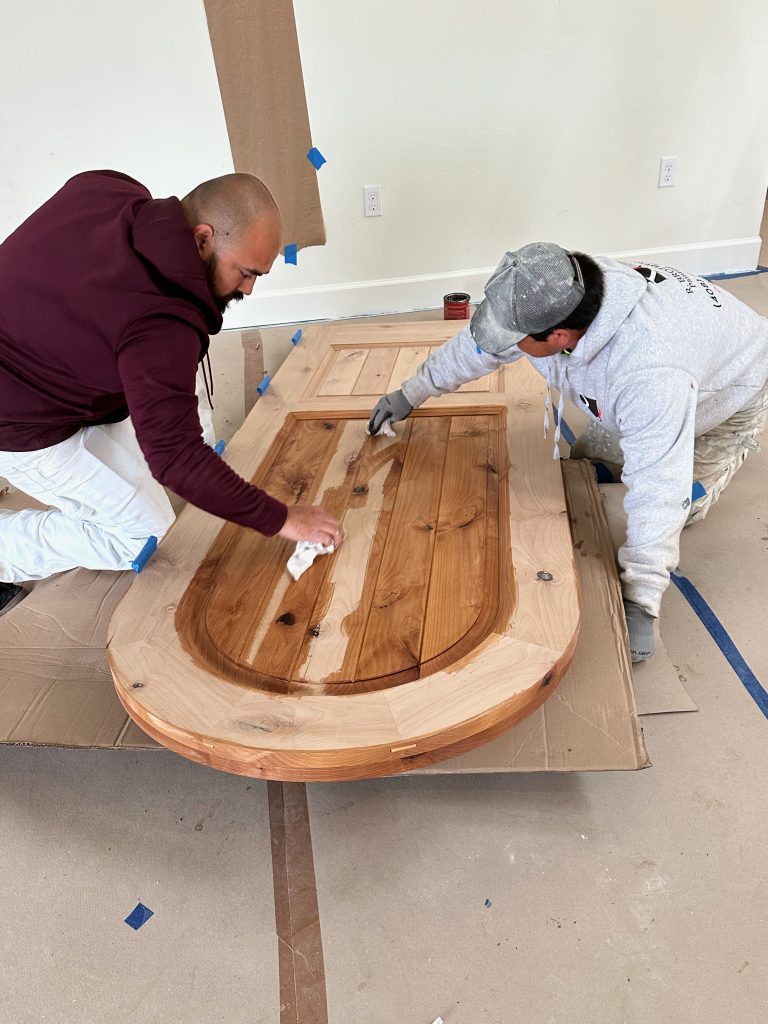 January 17 2024 new front door being stained at Carmel-by-the Sea, California, USA, new house build